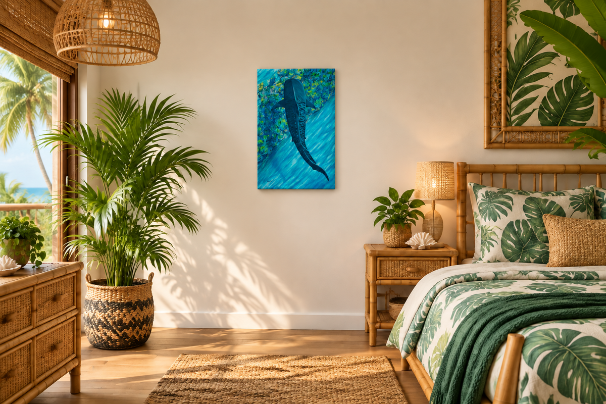 A tropical-themed bedroom featuring a vertical canvas print of a tiger shark underwater as the main wall art, styled with palm plants, rattan furniture, and green leaf-patterned bedding.